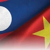 老挝副总理吉乔·凯坎匹吞会见越南红十字会中央委员会主席裴氏好一行