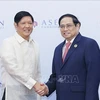 越南政府总理范明政会见菲律宾总统马科斯