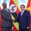 越南政府总理范明政会见乌干达总统约韦里