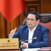 越南政府总理范明政：促进颁布有关债务重组和公司债券的两项通知
