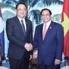 第42届东盟峰会：范明政总理会见老挝总理宋赛·西潘敦