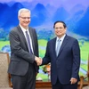 越南政府总理范明政会见法国驻越南大使