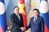 El presidente de la Asamblea Nacional de Laos, Saysomphone Phomvihane, preside la ceremonia de bienvenida a su homólogo vietnamita, Tran Thanh Man. (Fuente: VNA)