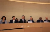 Deputy Foreign Minister Do Hung Viet (third from left) speaks at the UPR session adopting Vietnam national report (Photo broadcast by VNA) 