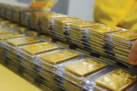 Domestic gold prices have surged, even topping 90 million VND (over 3,500 USD) per tael. (Photo: tapchicongthuong.vn)