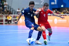 Vietnam (red) win 3 - 2 over Thailand in the last match of Group A at the ASEAN Futsal Championship 2024. (Photo: Vietnam Football Federation)