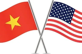 越南与美国国旗。图自越通社