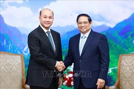 Le Premier ministre Pham Minh Chinh a reçu le 5 juillet à Hanoï Hun Many, membre de la Permanence du Parti du peuple cambodgien, secrétaire général de la Commission centrale de mobilisation de masse du Parti. Photo : VNA