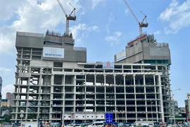 The construction of a building near Ben Thanh Market by Viva Land, a subsidiary of Van Thinh Phat Group, stalled at the end of 2022 following the arrest of the company’s chairwoman, Truong My Lan. (Photo: VNA)