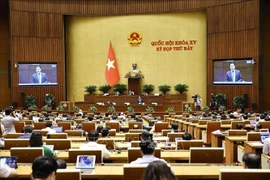 At a meeting as part of the 7th National Assembly's 15th session on June 21 afternoon. (Photo: VNA) 