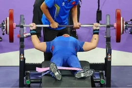 Chau Hoang Tuyet Loan competes in the women's powerlifting 55kg category during the Paris Paralympics on September 5. She was the last Vietnamese competitor at the event. (Photo: AFP/VNA)