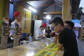 People enjoy Belgian beer at the festival (Photo: VNA)