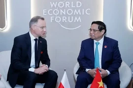 Le PM Pham Minh Chinh rencontre le président polonais Andrzej Duda