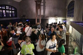 Tourists inside the Hoa Lo Prison relic site, known in French as Maison Centrale, an attraction in Hanoi’s Hoa Lo street, Hoan Kiem district. (Photo: VNA)
