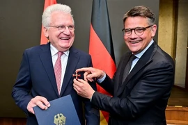 Minister-President of the State of Hessen of Germany Boris Rhein (R) presents Order of Merit to