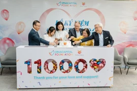 Don Lam, CEO and Founding Partner of VinaCapital, Chair of the VCF Board (first from right), Former Vice President of Vietnam Truong My Hoa (second from rìght) and other donors at the ceremony to celebrate the saving of 11,000 kids with CHD. (Photo courtesy of Heartbeat Vietnam)