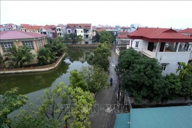 A rural road in Song Phuong commune, Dan Phuong district. All the 382 communes and 18 districts in capital city of Hanoi have satisfied new rural standards (Photo: VNA)