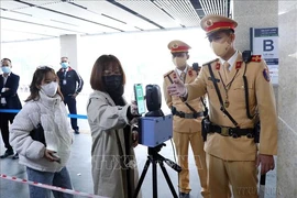 At a trial installation of QR code scanners at elevated railway stations in Hanoi on December 9, 2021. (Photo: VNA)