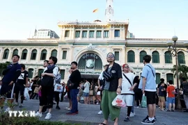 Korean tourists visit the central post office, a famous destination in Ho Chi Minh City. (Photo: VNA)