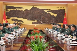 At the meeting between Minister of National Defence General Phan Van Giang and Vice Chairman of the Central Military Commission of China in Beijiing. (Photo: VNA)