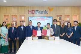 HDBank and Proparco’s leaders at a ceremony for signing a credit facility worth US$50 million in HCM City on September 16. (Photo courtesy of HDBank)