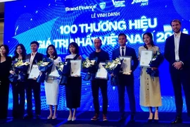 100 Vietnamese businesses with the biggest brand value are honoured at a ceremony in HCM City on October 11. (Photo: VNA)