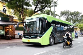 An electric bus in HCM City. By 2030, the Ministry of Transport wants 623 Compressed Natural Gas on the roads of Hanoi and HCM City. (Photo: VNA)