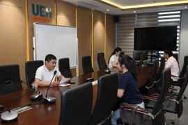 Job seekers attend an interview at the UEH Career Fair in HCM City on November 3. (Photo courtesy of the University of Economics HCM City)