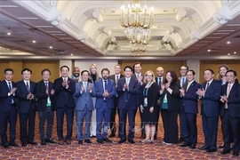 Le président Luong Cuong et lé délégués de l'Alliance des entreprises États-Unis – APEC. Photo : VNA