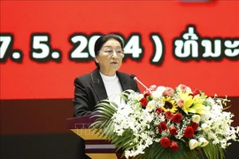 老挝国家副主席巴妮·雅陶都发表讲话。图自越通社