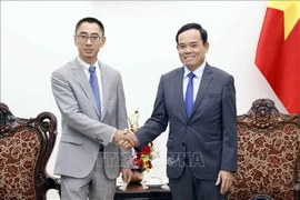 越南政府副总理陈流光会见华为公司副总裁。图自越通社