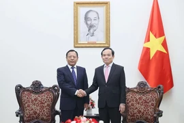 越南政府副总理陈流光会见了中国国家民族事务委员会副主任边巴扎西。图自越通社