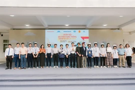 Students and teachers of Kim Anh High School with the quality helmets offered by AIP Foundation in collaboration with Johnson&Johnson Vietnam. (Photo courtesy of AIP Foundation)