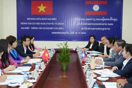 At the talks between General Director of the Vietnam News Agency (VNA) Vu Viet Trang and General Director of the Lao News Agency (KPL) Vannasin Simmavong. (Photo: VNA)