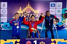 越南残疾人举重运动员黎文功获得金牌。图自越通社