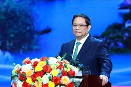 越南政府总理范明政在会议上发表讲话。图自越通社