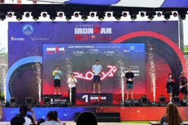 Male athletes with best performance at the 2024 VinFast IRONMAN 70.3 Vietnam receive awards. (Photo: VNA broadcasts)