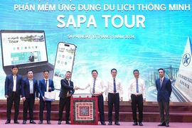 Representatives from agencies are at the launching ceremony of the app "Sapa Tour" to promote tourism in resort town of Sa Pa in northern province of Lao Cai. (Photo: nhandan.vn)