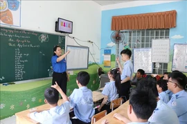 Children with hearing disability are in a class at Khanh Hoa province's Rehabilitation and Education Centre for Children with Disabilities. (Photo: VNA)