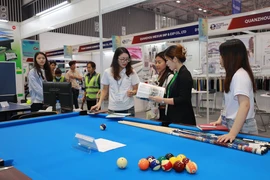 People are at a sport show in Vietnam. (Photo: VNA)