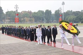 Party and State leaders pay tribute to President Ho Chi Minh at his mausoleum in Hanoi on July 27. (Photo: VNA) 