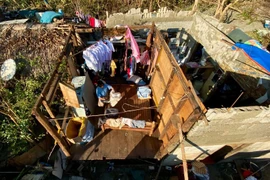 A house with its roof being blown off by a typhoon in Claveria town in the Philippines' Cagayan province. (Photo: EPA)