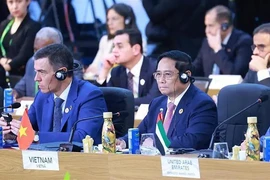 Prime Minister Pham Minh Chinh (R) attends the G20 Summit in Rio de Janeiro. (Photo: VNA)