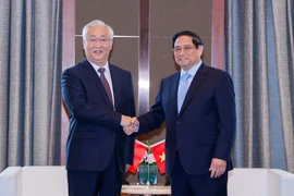Vietnamese Prime Minister Pham Minh Chinh (right) and Chinese Vice Premier Zhang Guoqing. (Photo: VNA)