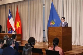 越南国家主席梁强在智利大学发表演讲。图自越通社