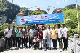 A group of 4,500 visitors organised by an Indian billionaire's pharmaceutical company arrives in Ninh Binh province on August 28, beginning their journey to explore the Trang An eco-tourism site in Hoa Lu District. (Photo: VNA)