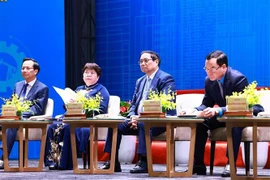 PM Pham Minh Chinh (second from right) attends the national forum on labour productivity. (Photo: VNA)