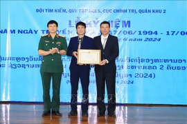 At the ceremony to mark 30th founding anniversary of the team held in Oudomxay province, Laos on June 17 (Photo: VNA)