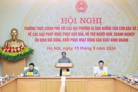 Le Premier ministre Pham Minh Chinh dirige une conférence sur le règlement des conséquences du typhon Yagi. Photo: VGP