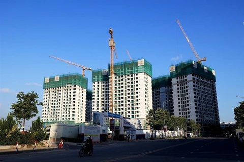 A housing project in HCM City. The State will regulate the market if property price rise by 20 per cent for three months. (Photo: VNA)